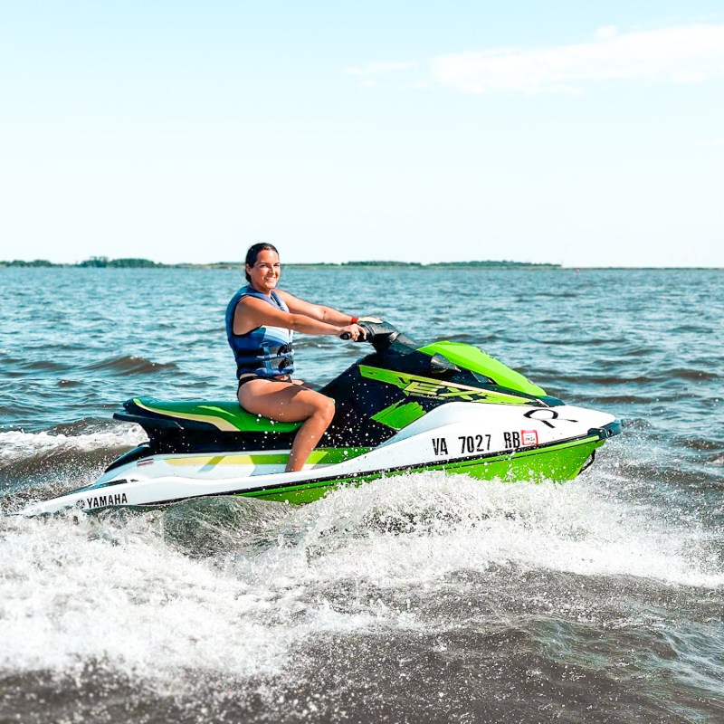 a man riding a wave on a surf board on a body of water