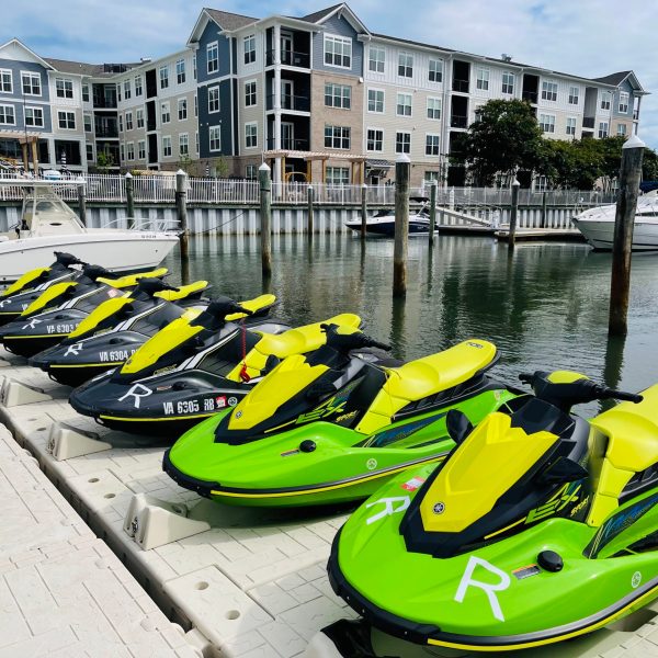 a row of parked motorcycles sitting in front of a building