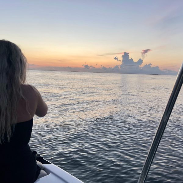 a person standing in front of a body of water
