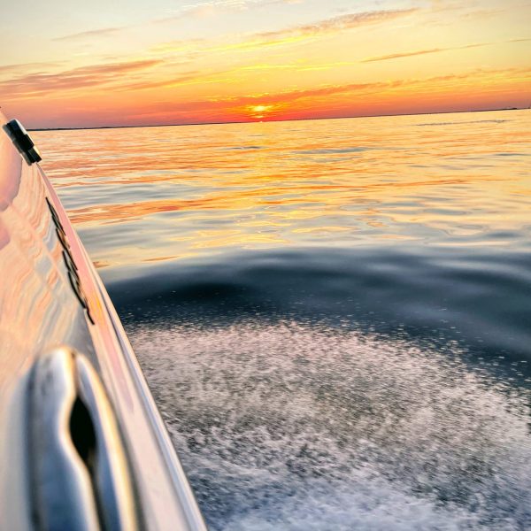 a sunset over some water