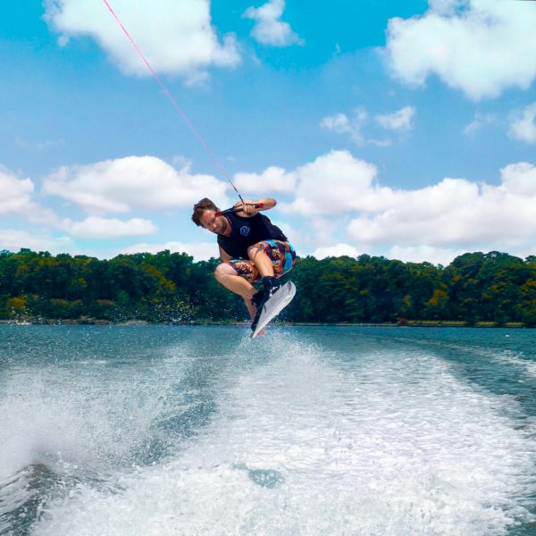 a man riding a wave on a surfboard in the water