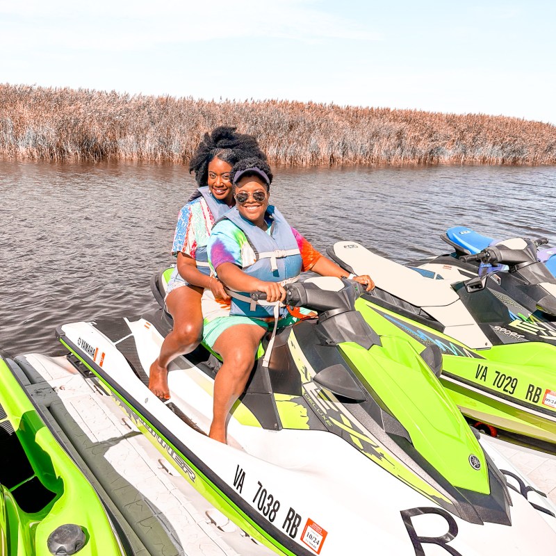 a group of people riding on the back of a boat