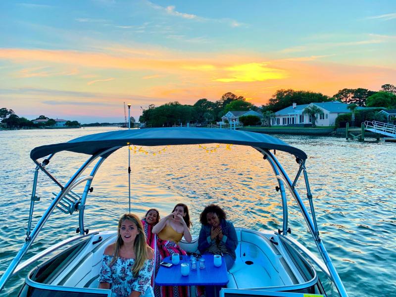 a group of people in a boat on a body of water