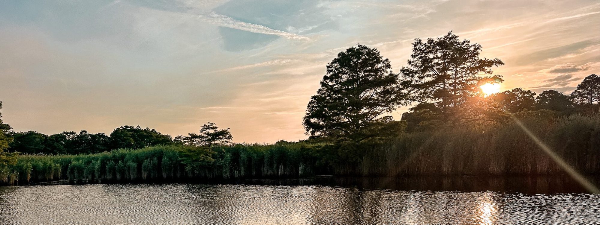 a sunset over a body of water