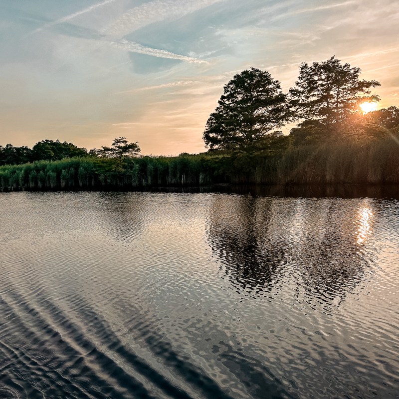 a sunset over a body of water