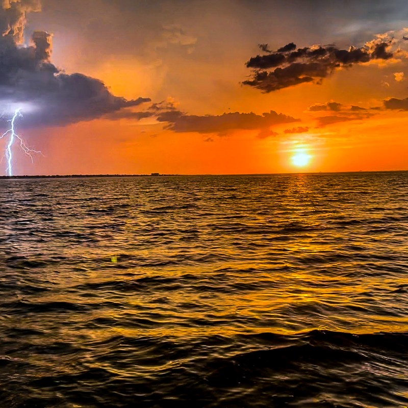 a sunset over a body of water