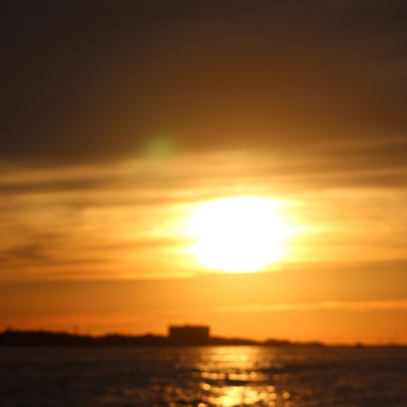 a sunset over a body of water