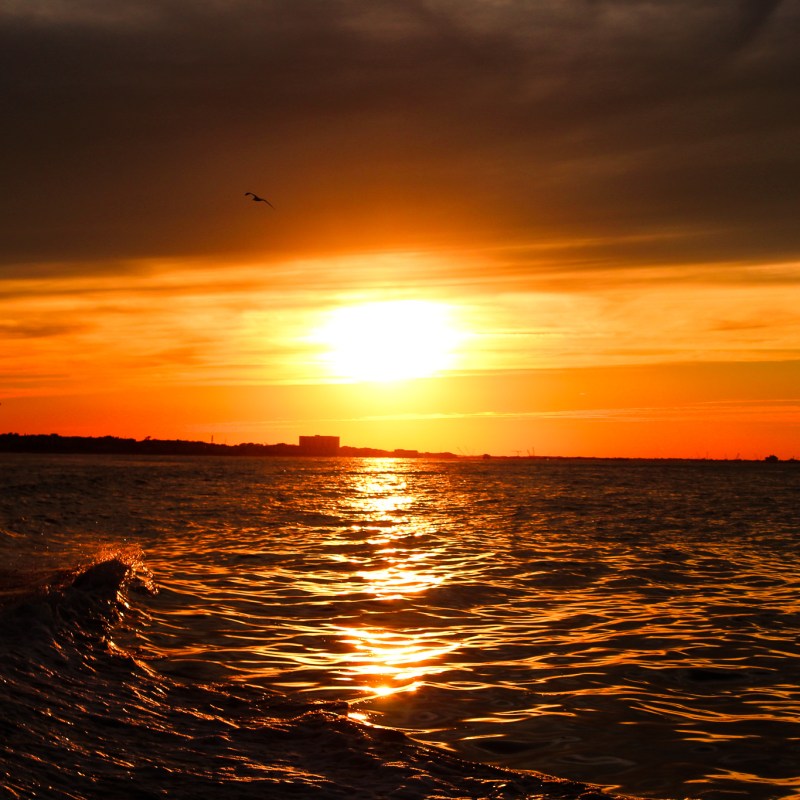 a sunset over a body of water