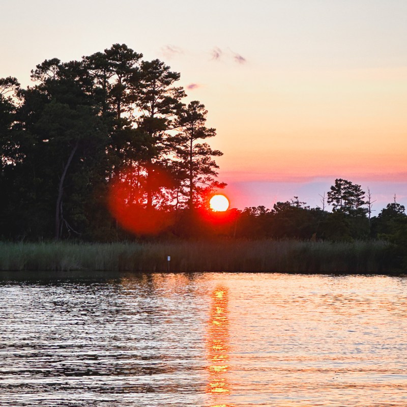 a sunset over a body of water