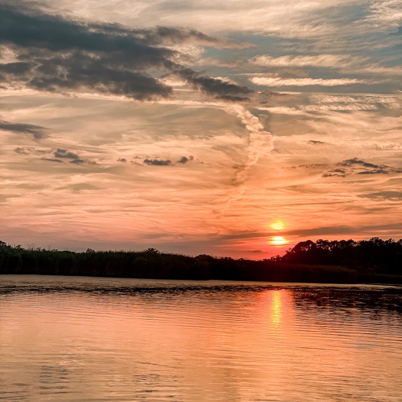 a sunset over a body of water