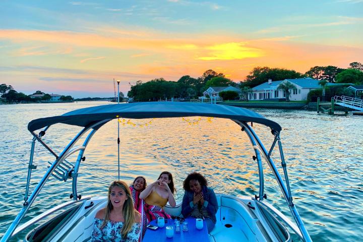 a group of people in a boat on a body of water