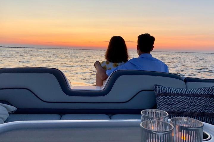 a person sitting next to a body of water