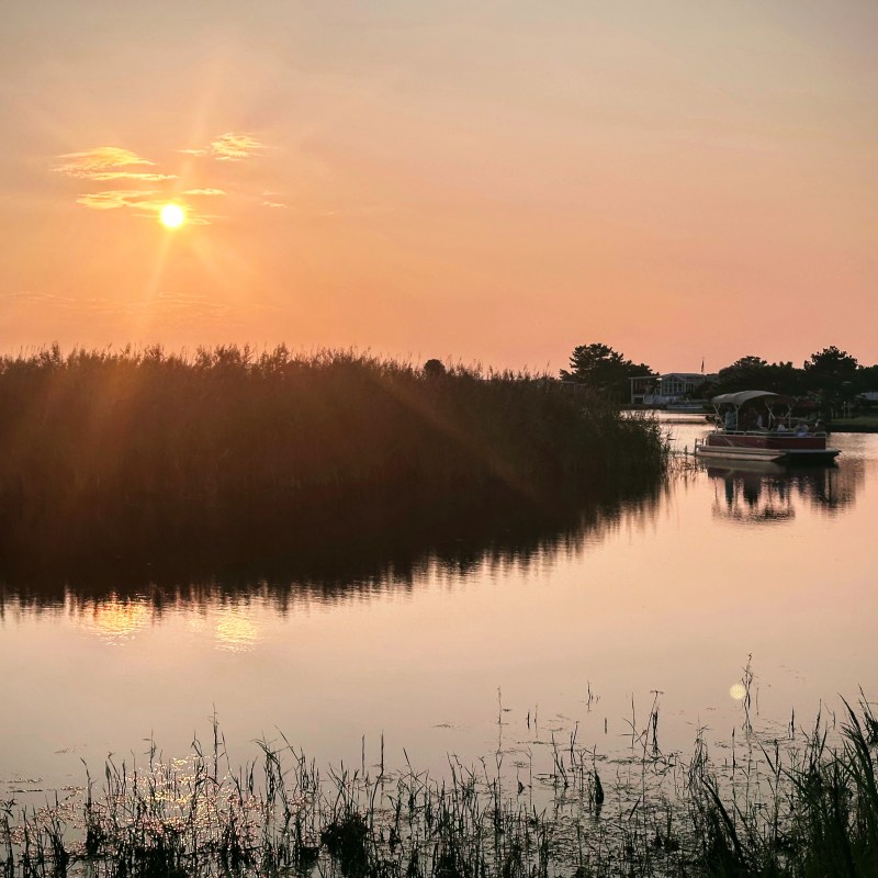 a sunset over a body of water