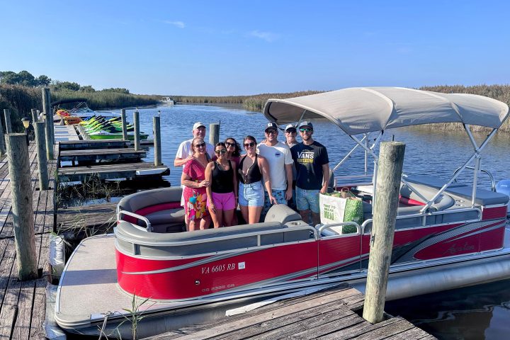 a group of people in a boat on a body of water